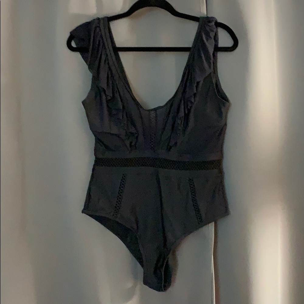 One Piece Black Suit with cut outs and ruffles